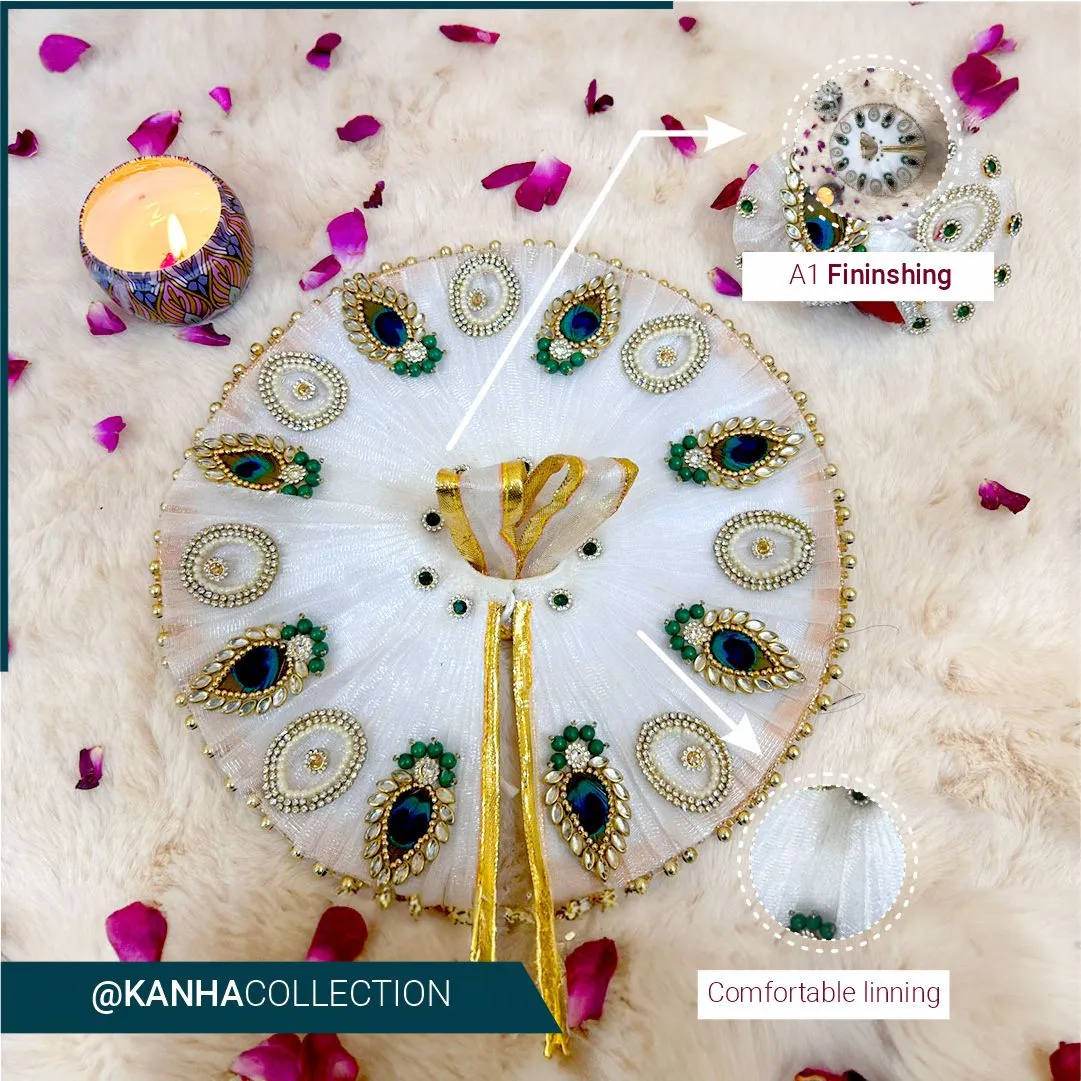 Beautiful designer white dress with mor booti and pearl stones